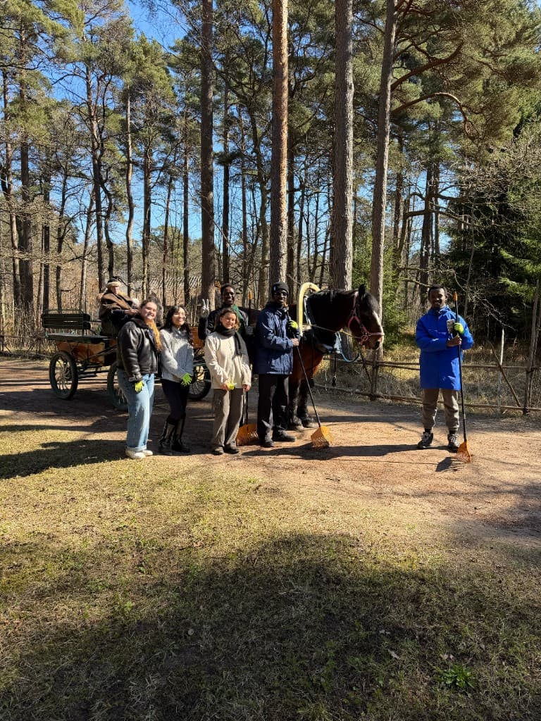Volunteer group with horse cart